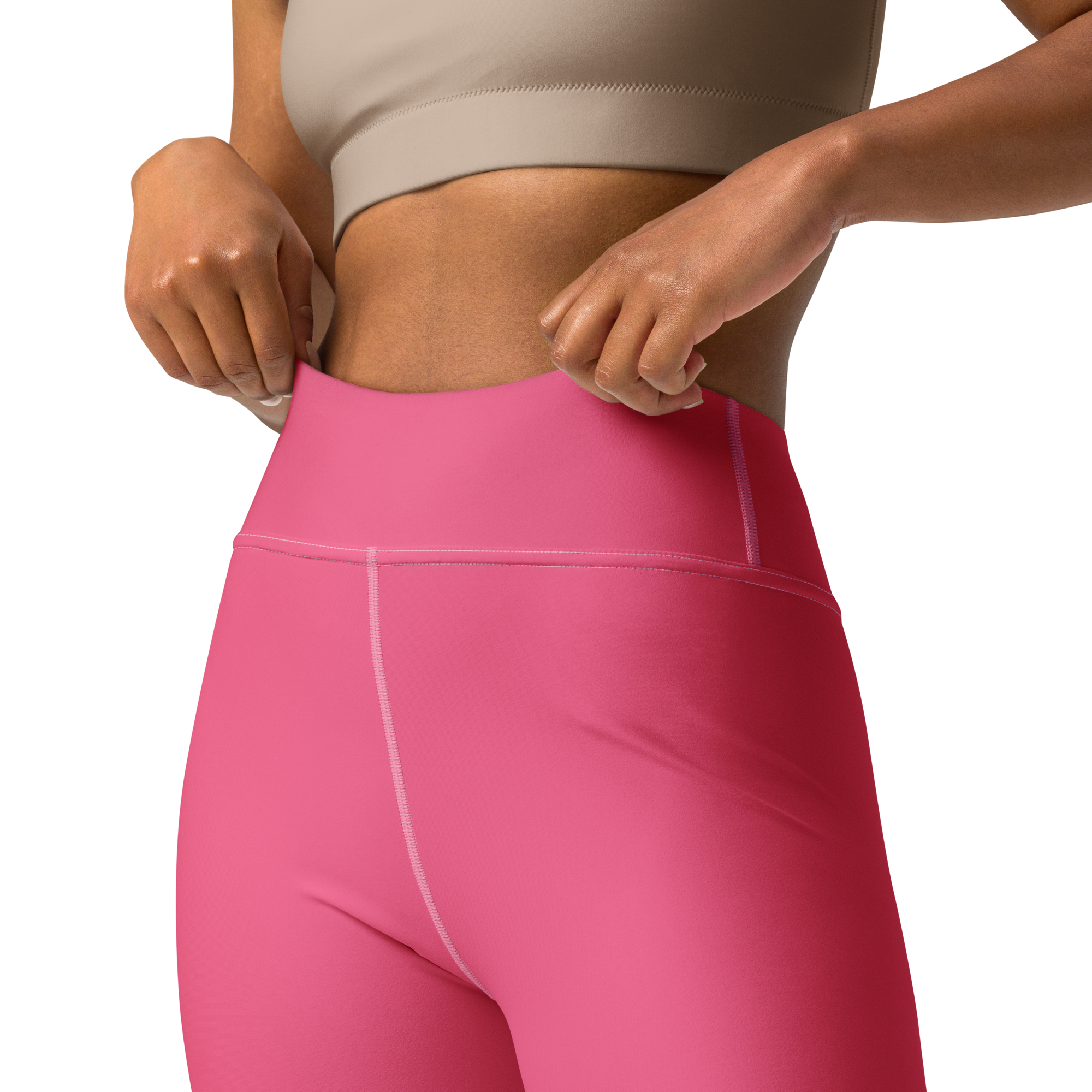 Person in a sports bra and pink leggings.