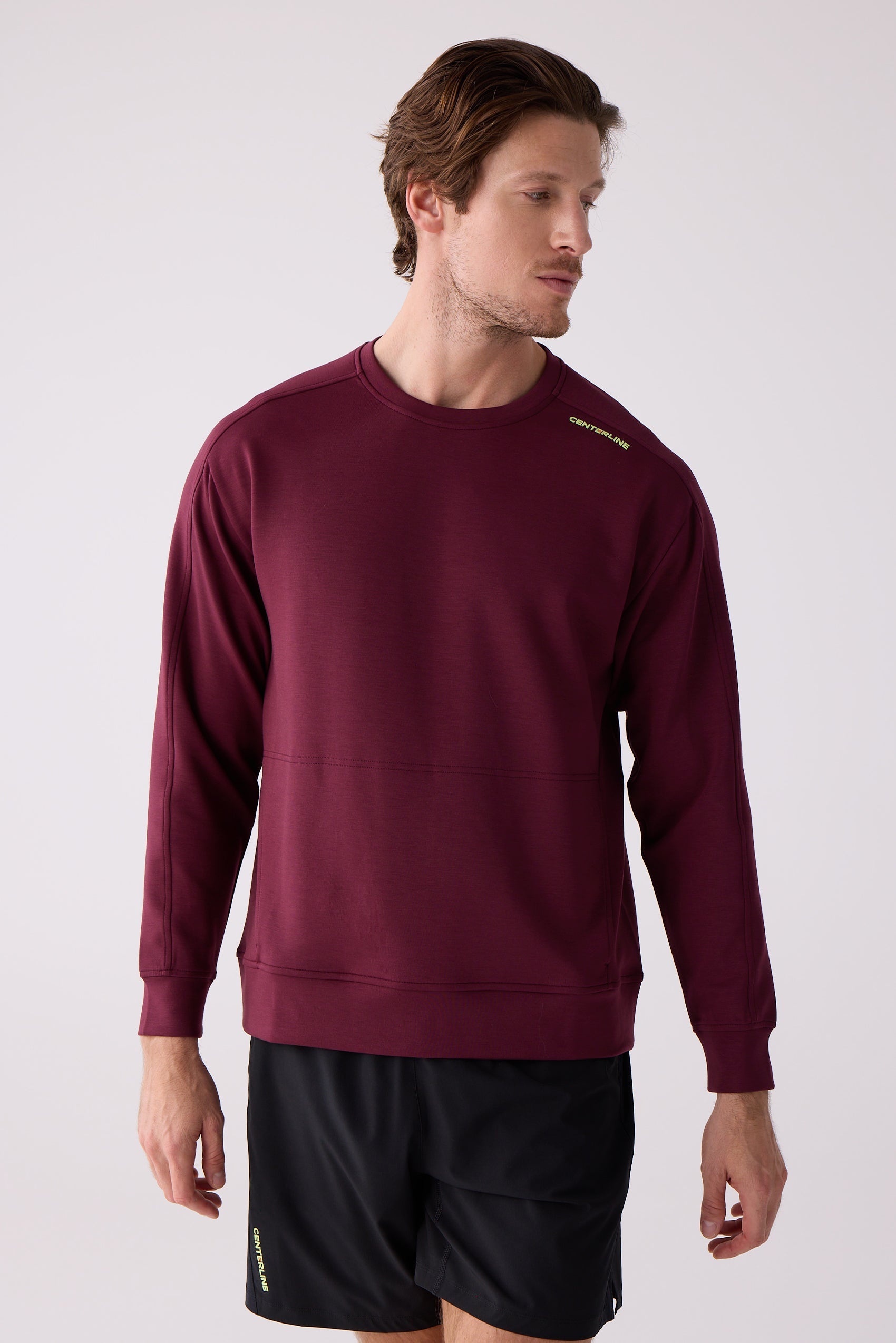 Maroon men's crew sweatshirt by Centerline Athletics, with 'CENTERLINE' on the shoulder, worn with black shorts also displaying 'CENTERLINE'.