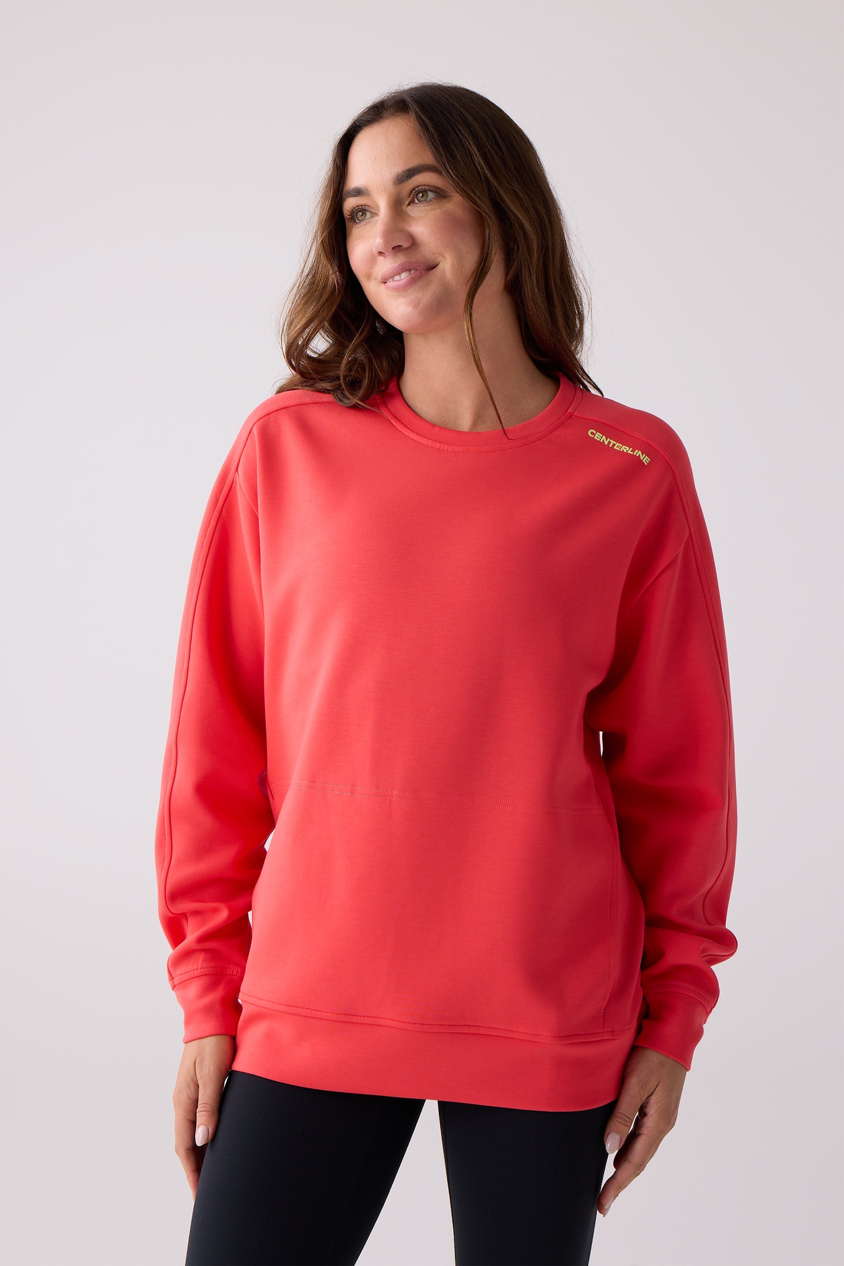 Red women's crew sweatshirt by Centerline Athletics with yellow 'CENTERLINE' text on the shoulder, worn with black leggings.