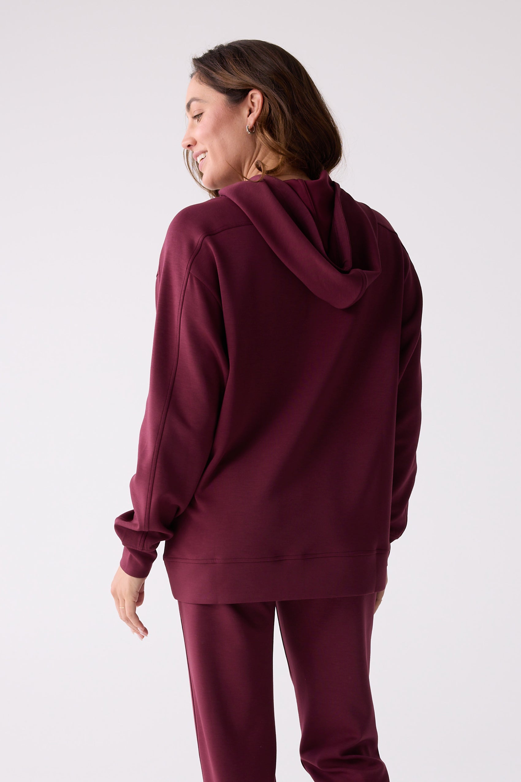 Burgundy hooded sweatshirt by Centerline Athletics, seen from the back with an oversized fit and matching sweatpants.
