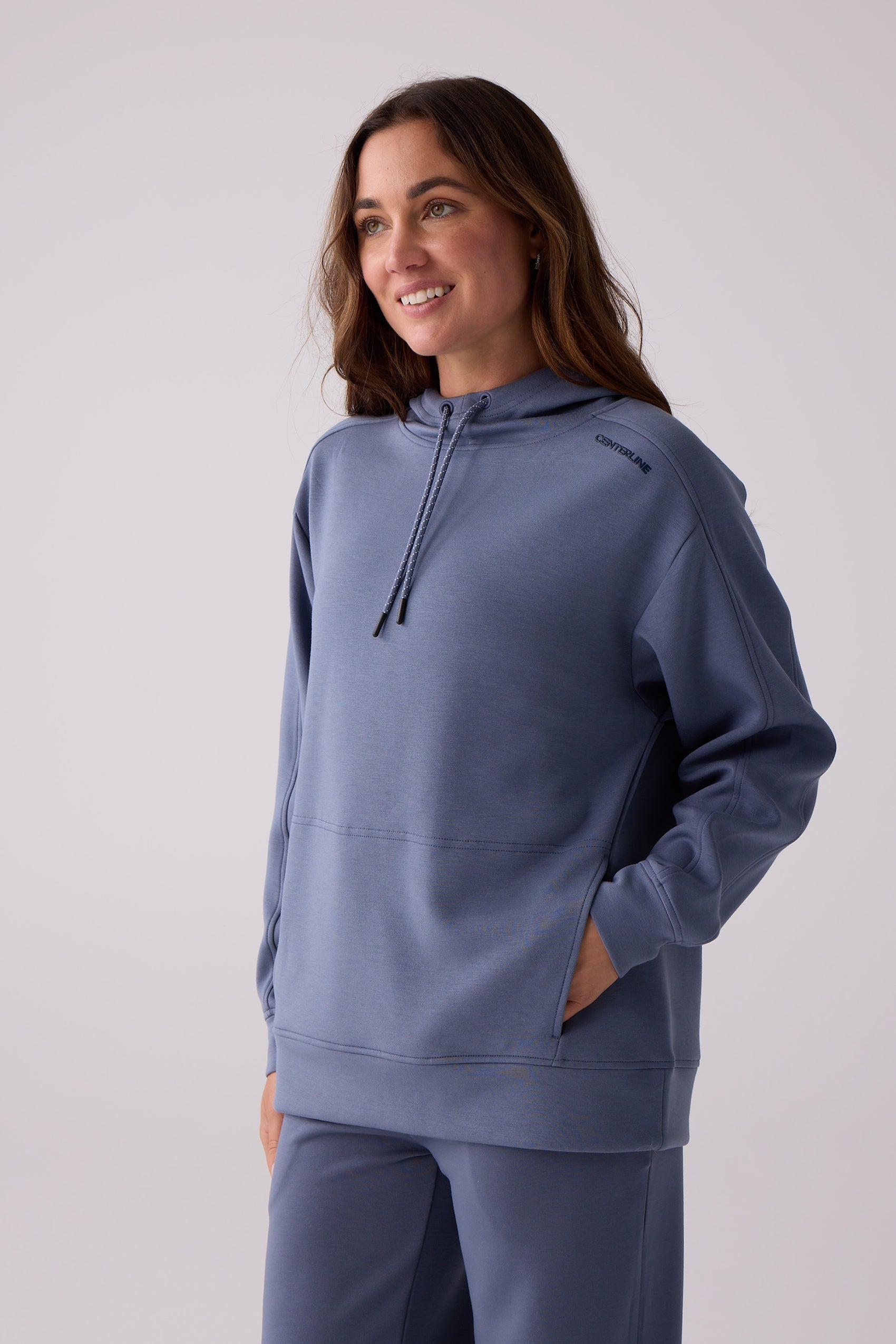 Dusty blue hooded sweatshirt by Centerline Athletics, with a drawstring hood, kangaroo pocket, and 'CENTERLINE' on the shoulder.