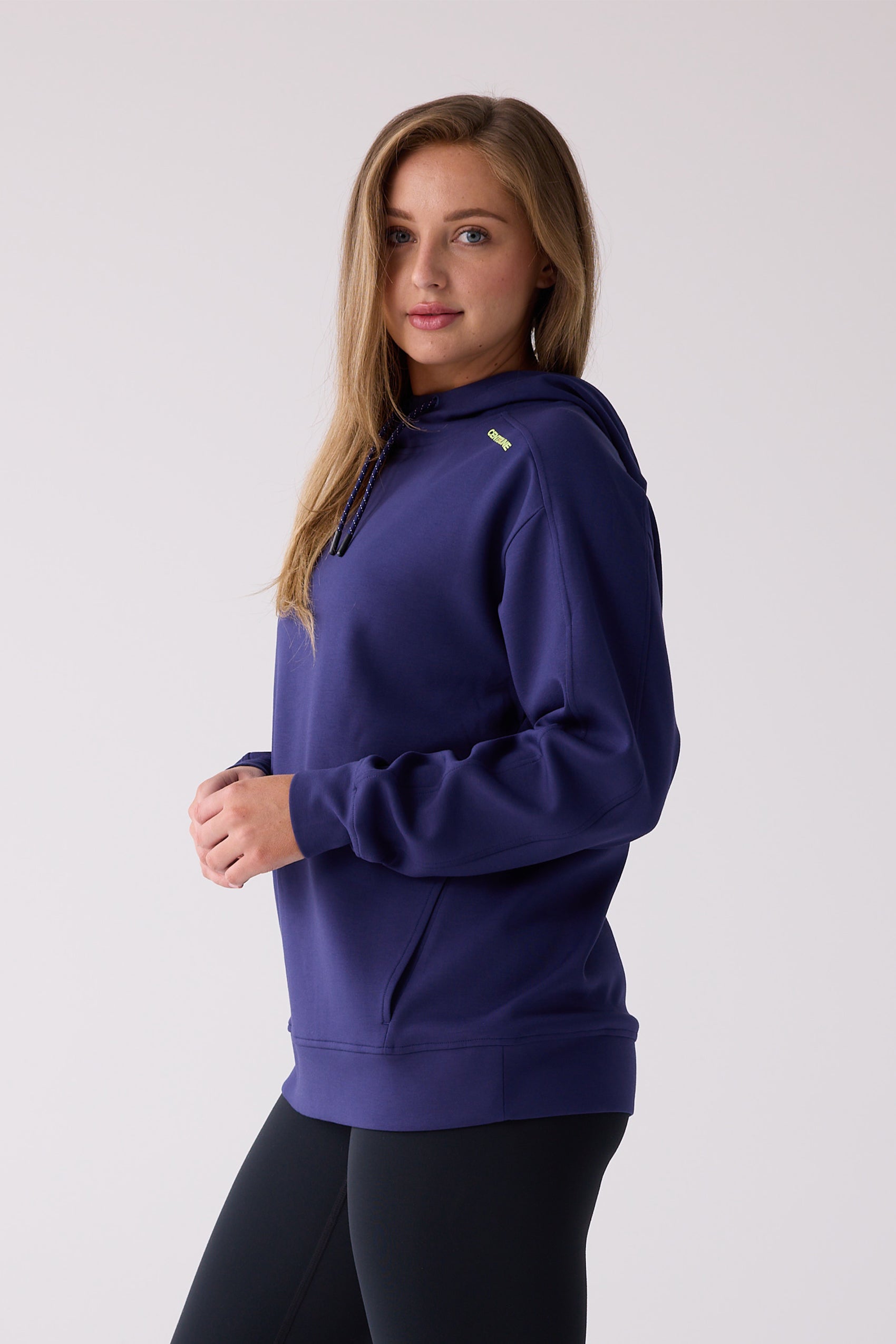 Navy blue hooded sweatshirt by Centerline Athletics with yellow logo, speckled drawstrings, and a kangaroo pocket, worn over black leggings.
