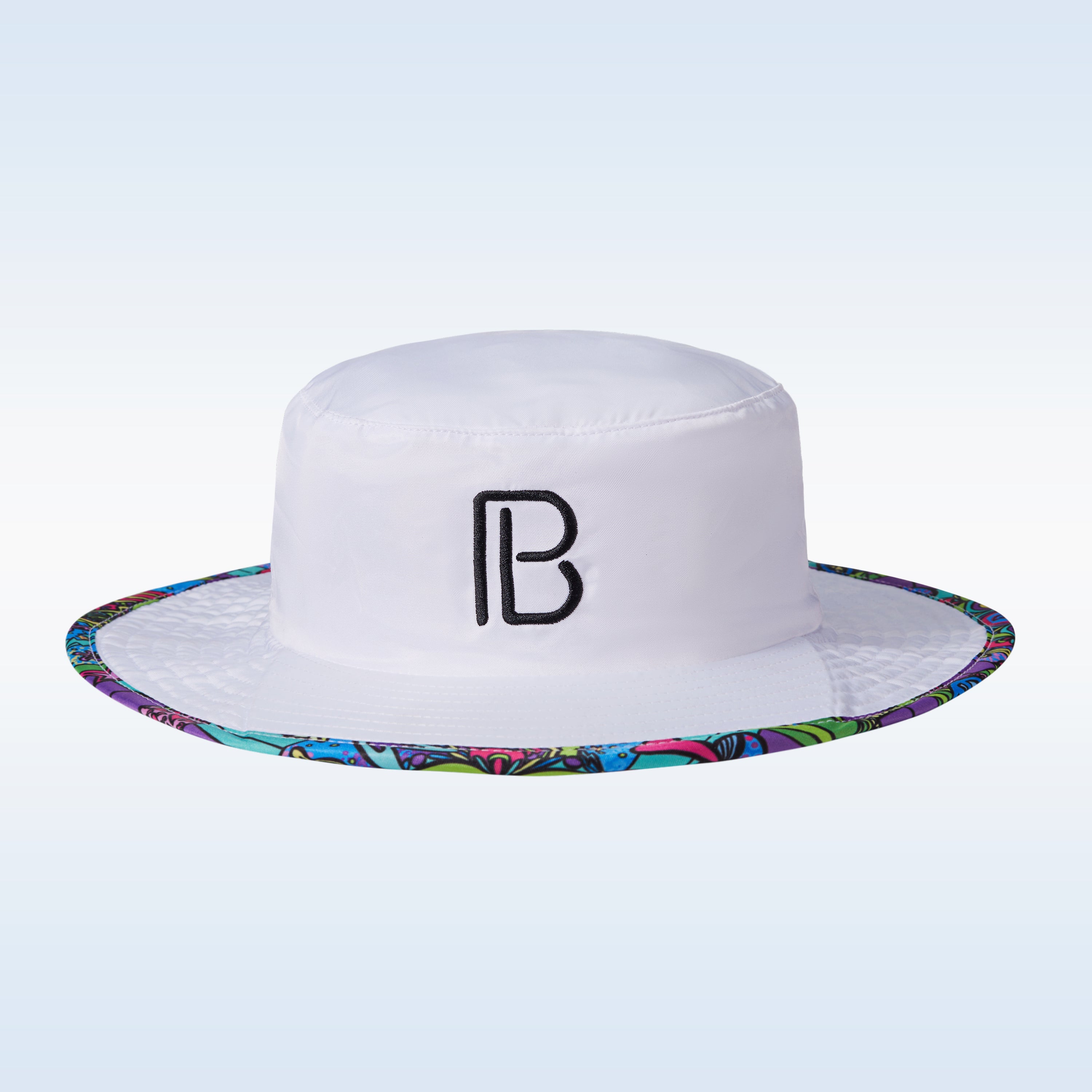 White bucket hat by Pickleball Bella, featuring a black "PB" logo and a colorful patterned brim.