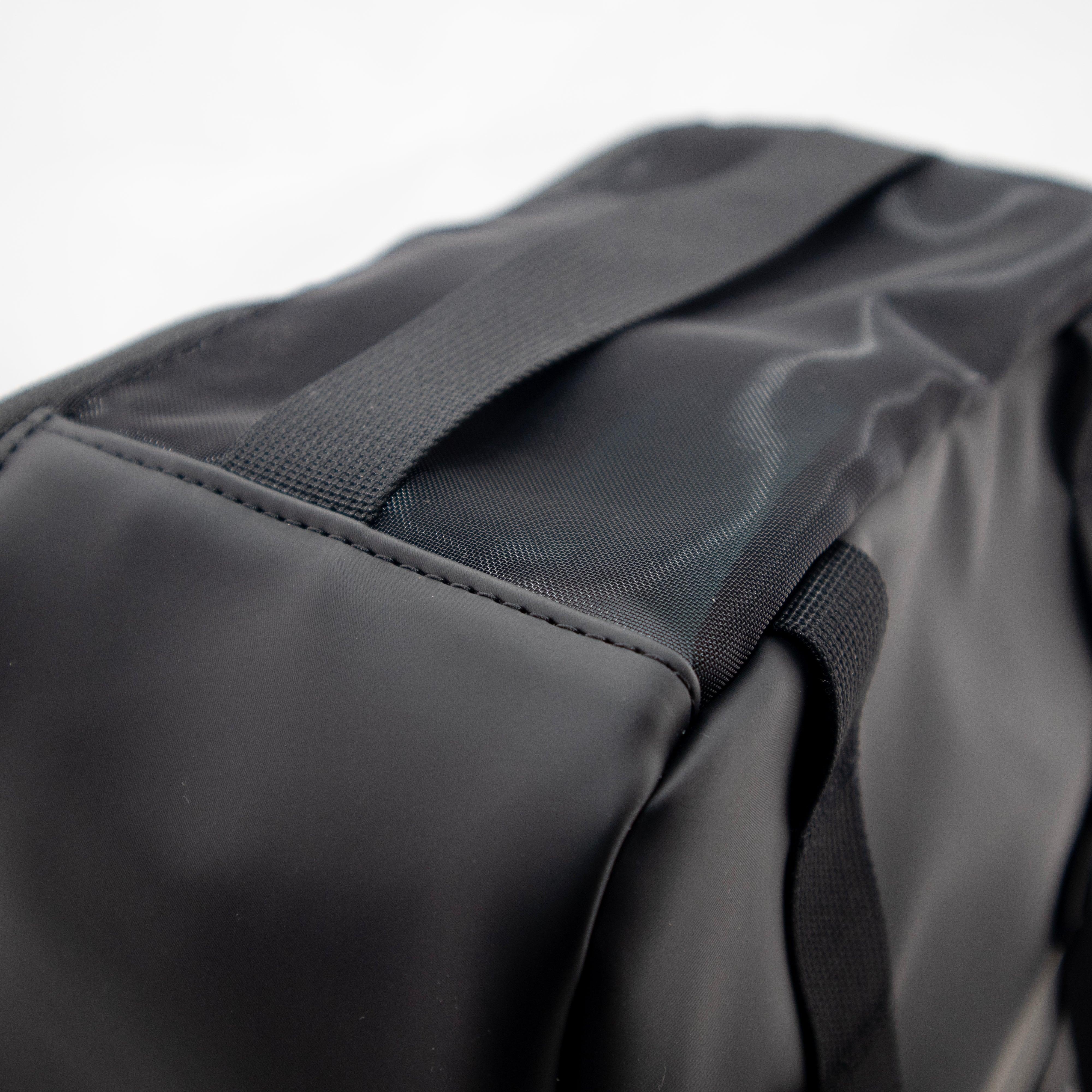 Black flexible Court Caddy Shoe Cube by FORWRD, featuring textured mesh panels and woven straps with visible stitching.