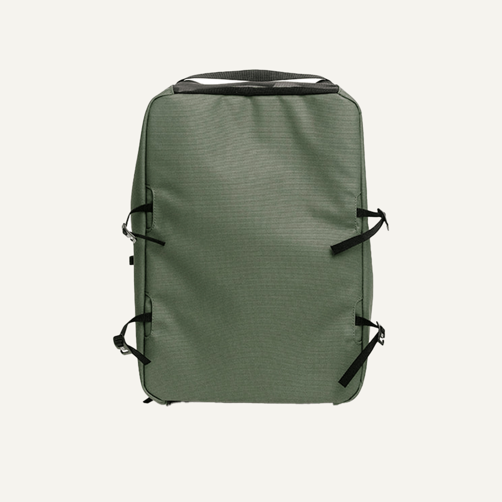 Olive green Court Caddy Shoe Cube by FORWRD with a ribbed texture, black side straps, and a top handle.