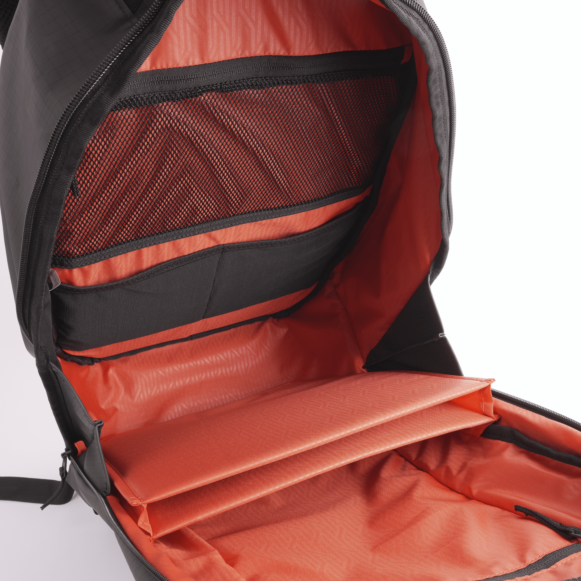 Black Court Ranger Pickleball Backpack by FORWRD, open to reveal a bright orange interior with mesh and padded pockets.