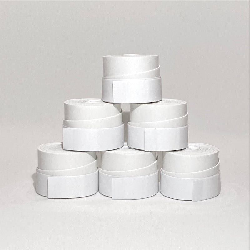 Six stacked rolls of white tape.