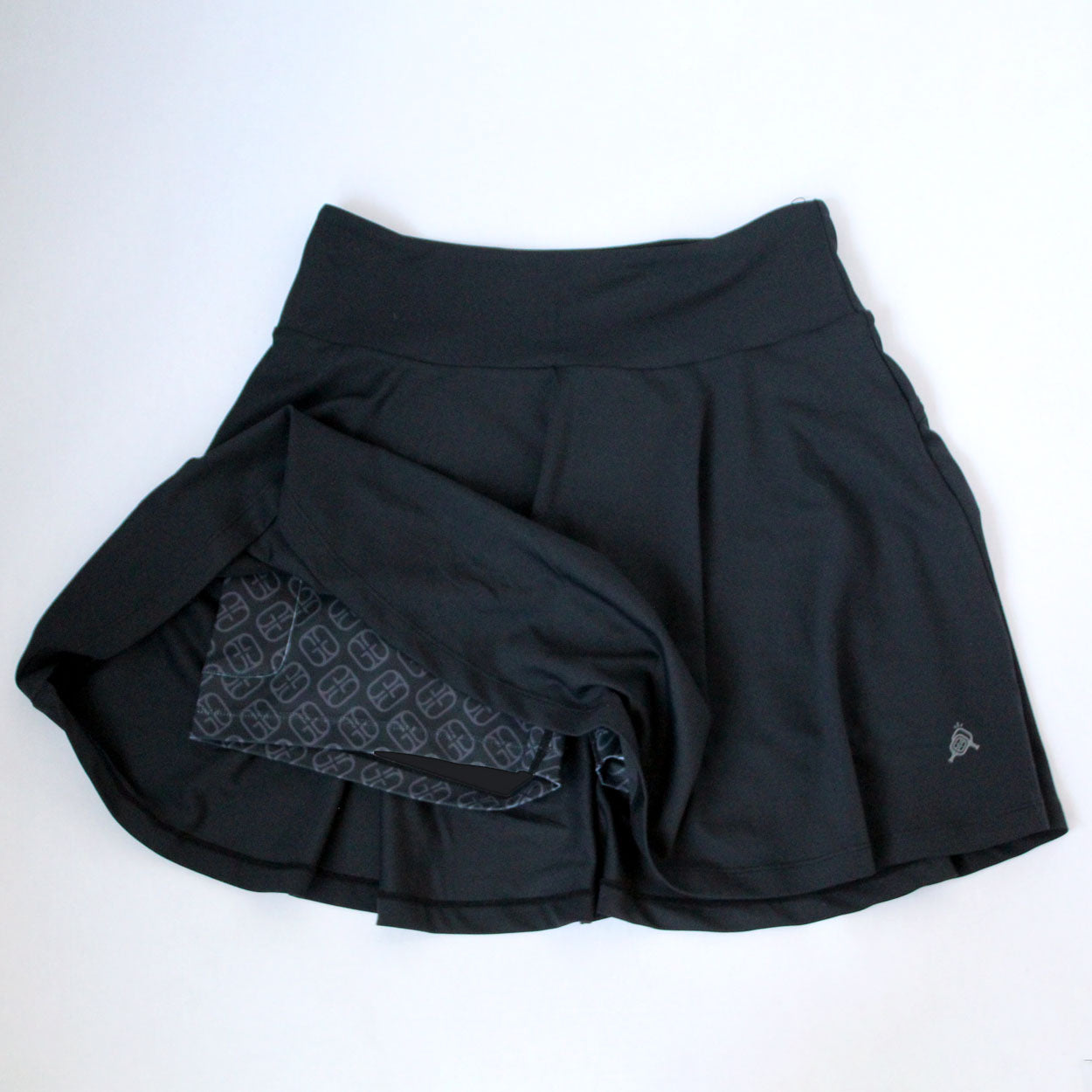 Black a-line pickleball skirt by Good Get, with patterned inner shorts and a small grey logo.